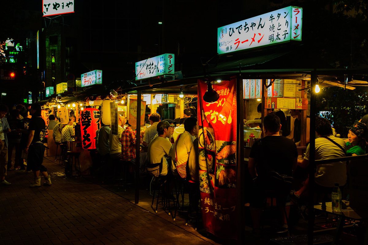Yatai stalls lit up along the Nakasu riverside, Fukuoka